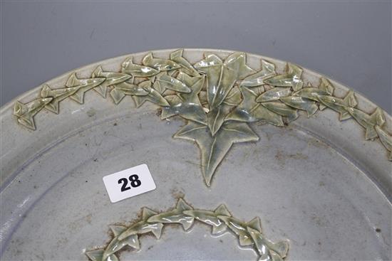 A Studio pottery tray, decorated with ivy leaves, seal mark to rim JC, diameter 35cm